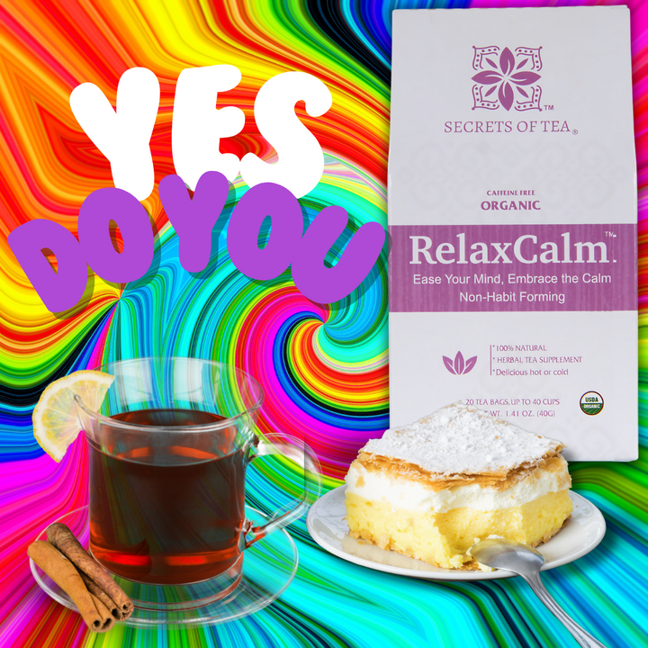 A mug of RelaxCalm Organic Herbal Tea by Secrets of Tea steams on a wooden table. The box in the background highlights the tea’s stress relief and sleep support properties.