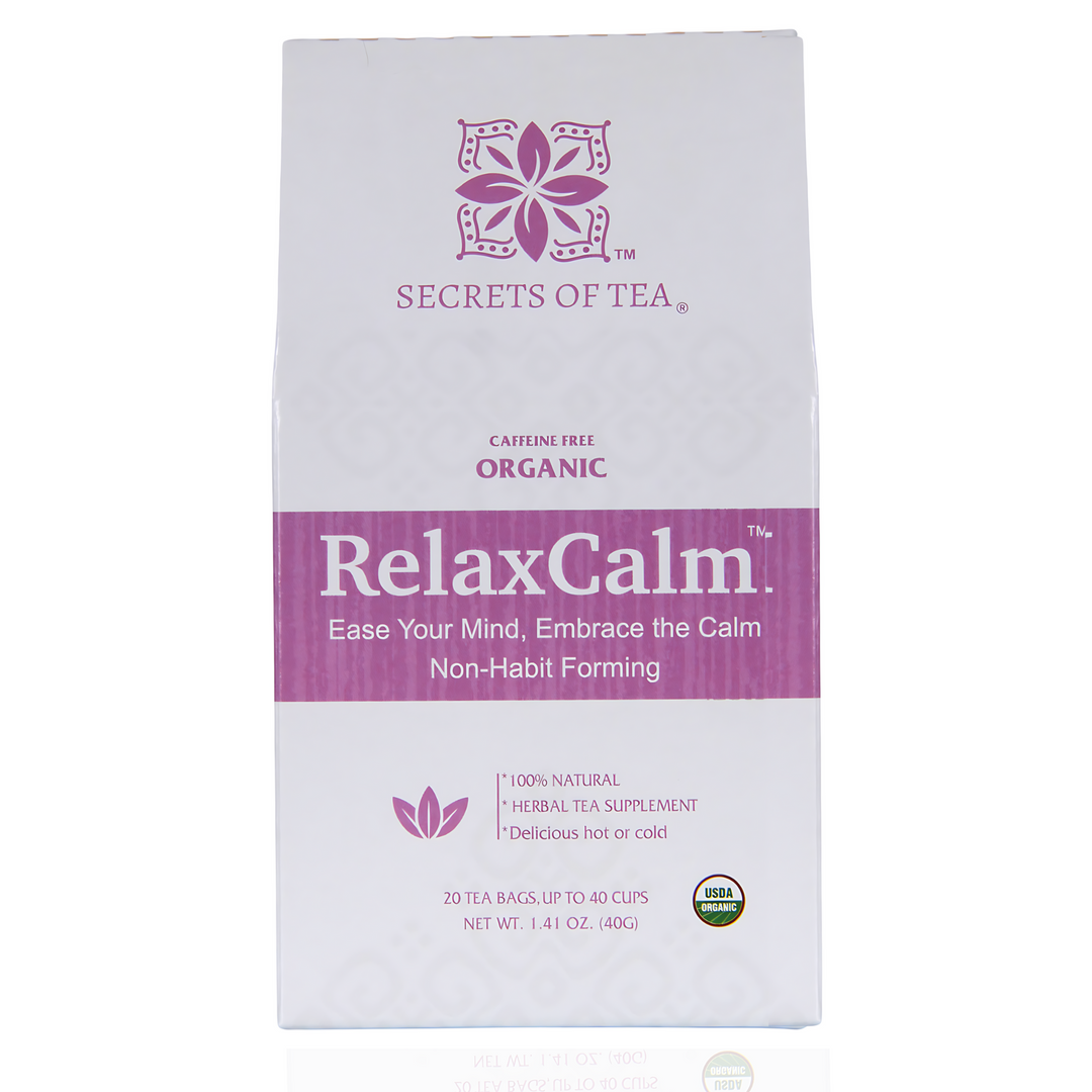 A box of RelaxCalm Organic Herbal Tea by Secrets of Tea with twenty tea bags. Text on the box emphasizes the tea’s stress relief and sleep support qualities. Ingredients include rooibos, lavender, chamomile, ginger, rosehip, lemon peel, and lemon balm.